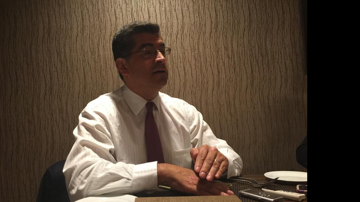 
Democrat Xavier Becerra, a congressman from Los Angeles, speaking with reporters Friday evening at the California Democratic Party convention in Orange County.
