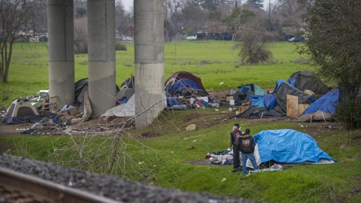 A homeless encampment along the Sacramento River.