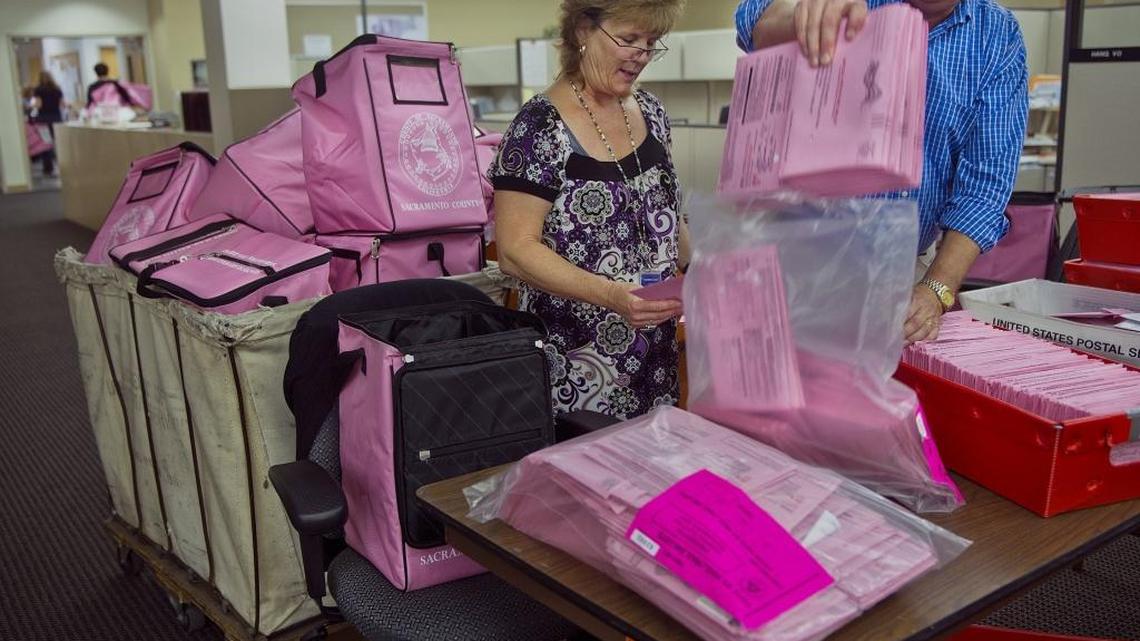 Sacramento County election workers processed mail ballots in November 2012. Mail ballots postmarked Tuesday have until Monday to arrive at election offices, and an untold number of mail ballots and provisional ballots were dropped off at polling stations Tuesday.