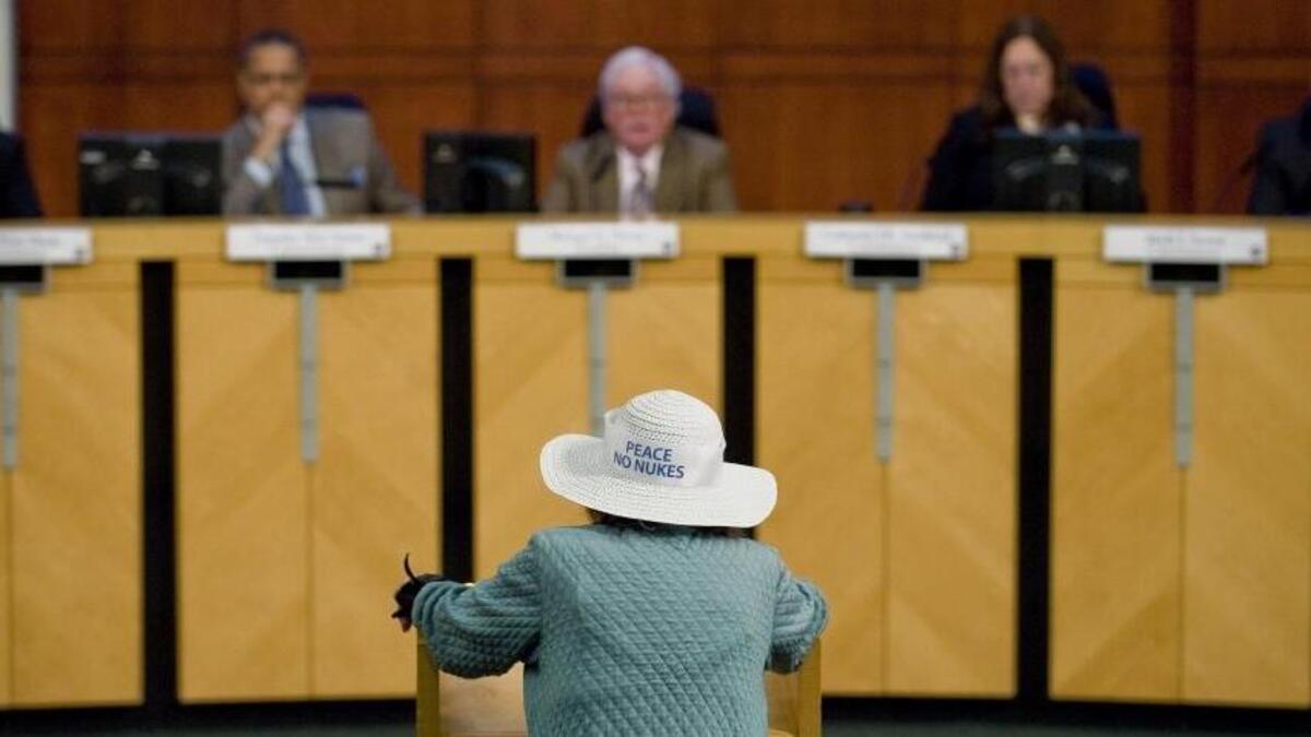 Members of the California Public Utilities Commission listen to Lyn Harris Hicks speak at Irvine City Hall on Oct. 25, 2012.