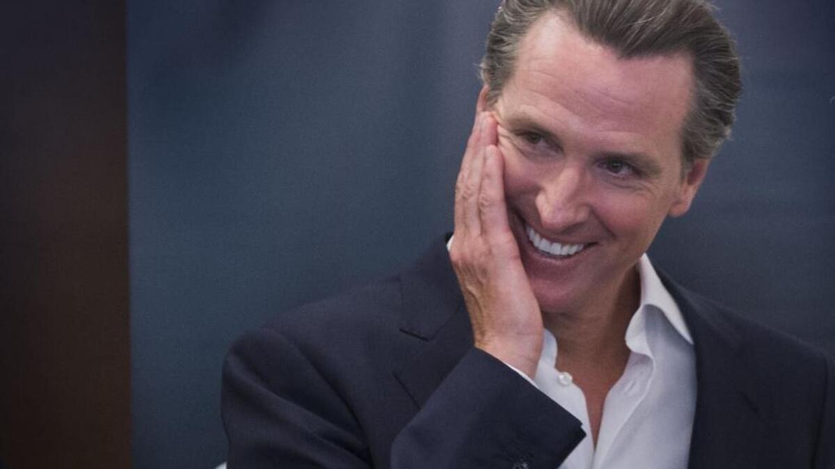 Lt. Gov. Gavin Newsom takes a moment after speaking at the California delegation breakfast in Philadelphia on July 28, 2016.
