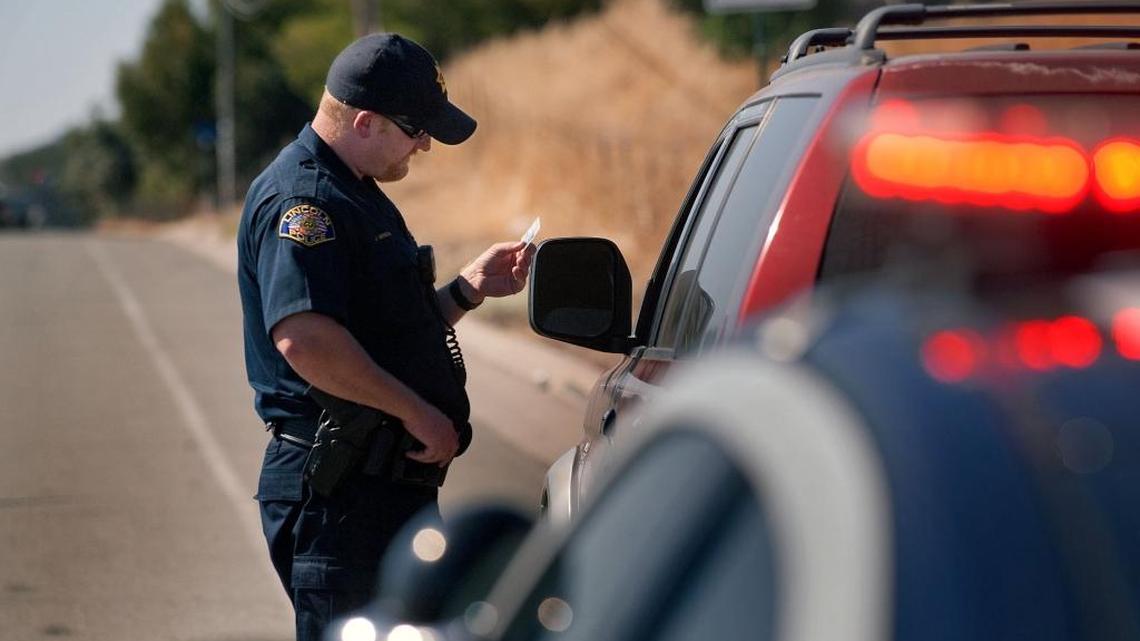 Police Officer Jeromy Henson performs a traffic stop during his shift in Lincoln on Wednesday, Sept. 29, 2010.