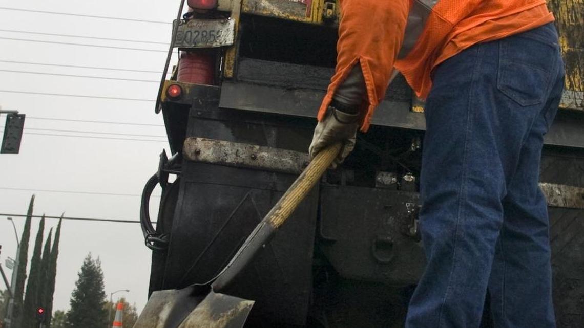 
A Highway Maintenance Worker with the County of Sacramento's Dept. of Transportation, fills in potholes on Wednesday, November 26, 2008 on Keifer Road.
