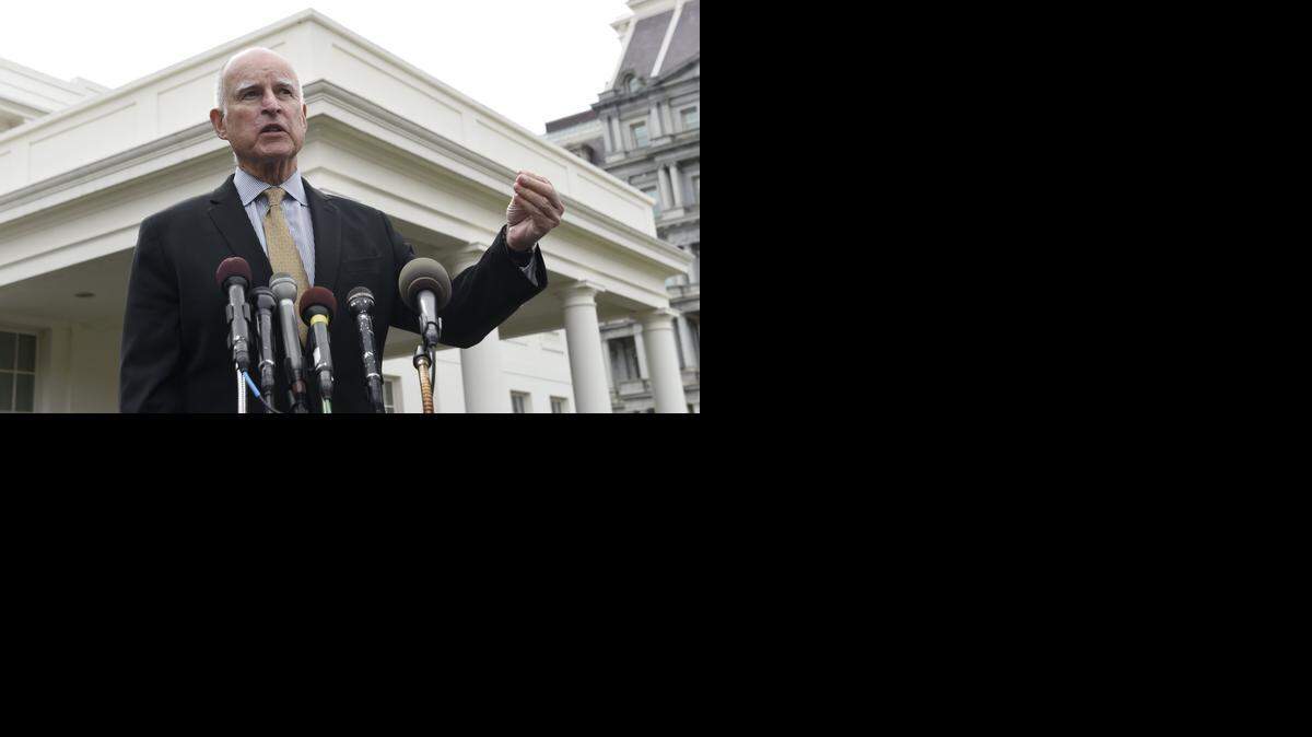 
Gov. Jerry Brown speaks to reporters outside the White House during a visit to Washington on March 13. After being asked then about Hillary Clinton’s emails, he has released some correspondence from his private account.
