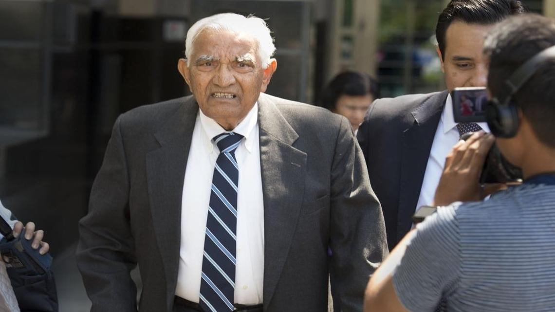 Babulal Bera, the father of Democratic Rep. Ami Bera, leaves the federal courthouse on May 10 with his attorney, Edward Loya Jr., right. The elder Bera is scheduled to be sentenced in federal court Thursday for two counts of campaign finance violations.