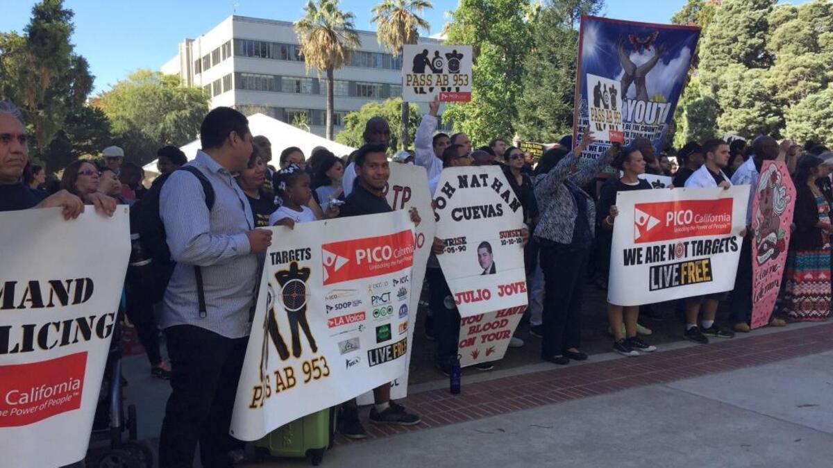 Protesters rally outside the Capitol in Sacramento to support a bill that would require more data on police stops on Sept. 2, 2015.