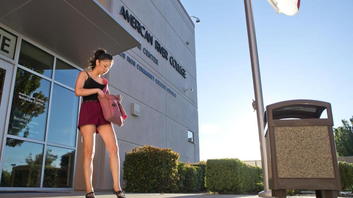 Ivania Areas, 18, waits for the doors to open at the American River College Natomas Center on August 26, 2013.