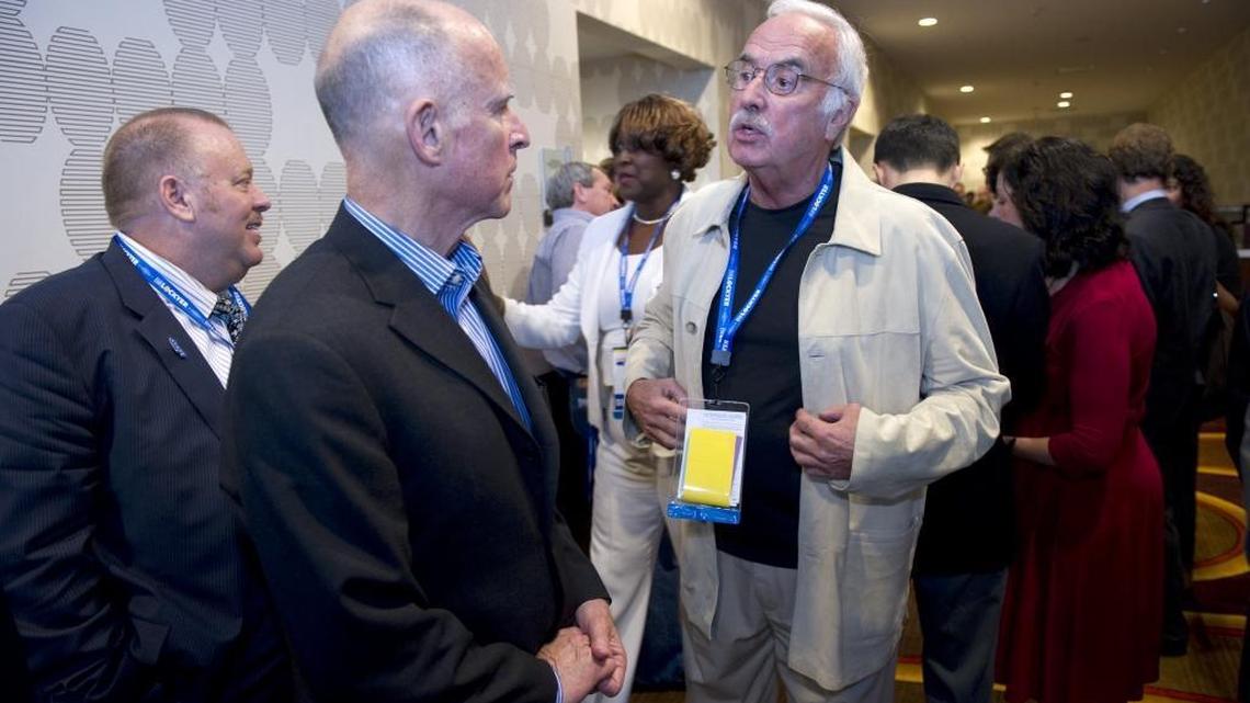 California Democratic Party chair John Burton, right, speaks with gubernatorial candidate Jerry Brown during the party’s state convention in 2010 in Los Angeles.