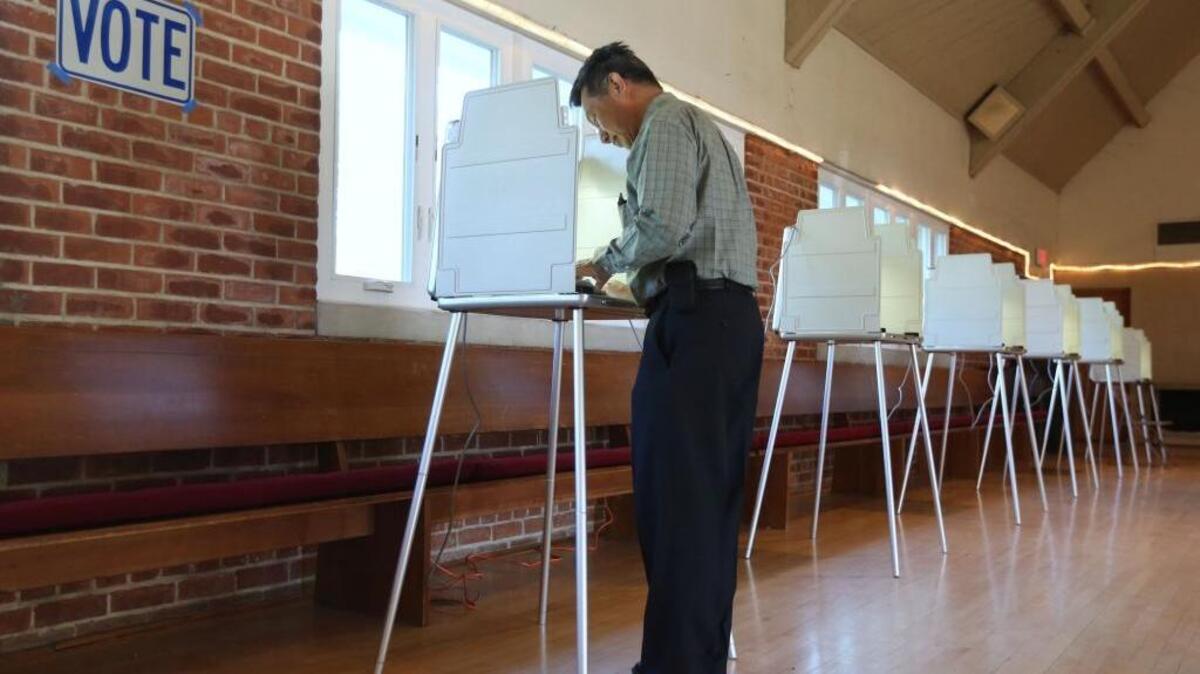 A Sacramento man marks his ballot while voting in the California Primary, in Sacramento,Calif., Tuesday, June 3, 2014.