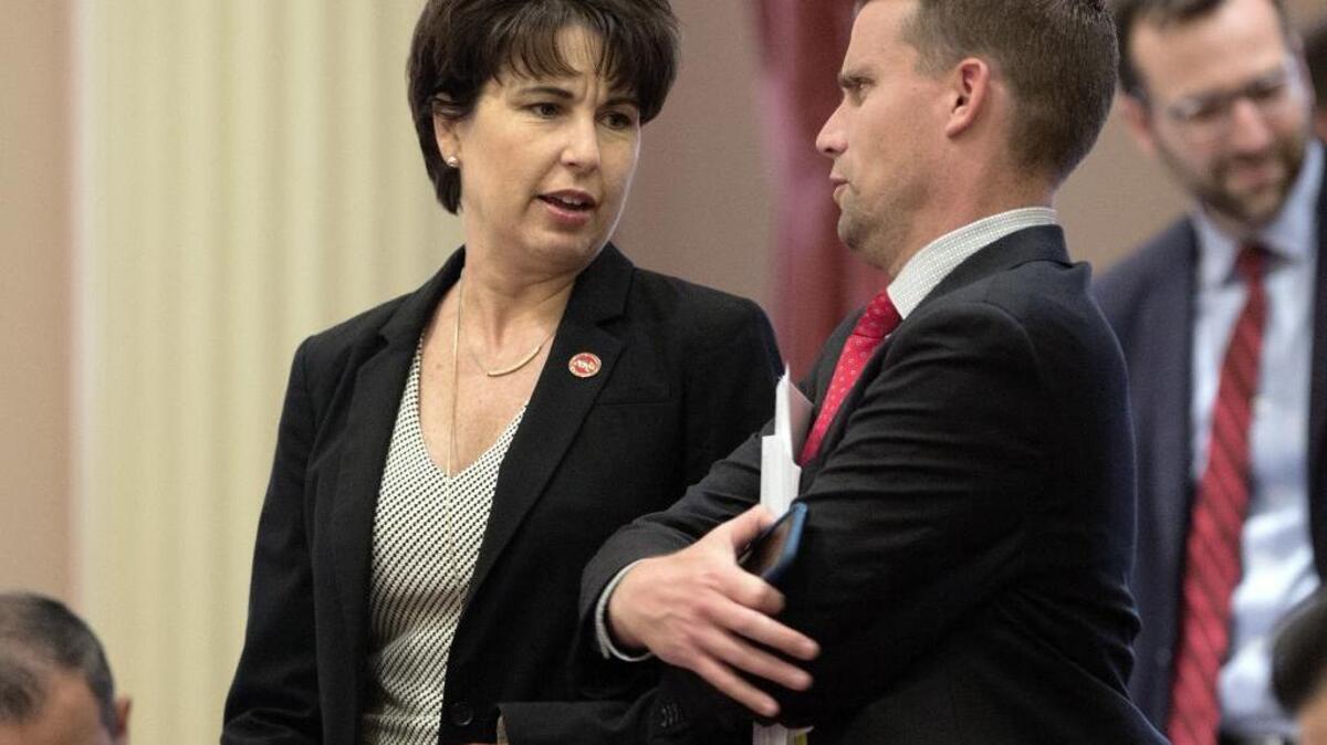 Sen. Connie Leyva, D-Chino, talks with Sen. Mike McGuire, D-Healdsburg, at the Capitol on Aug. 18, 2016.