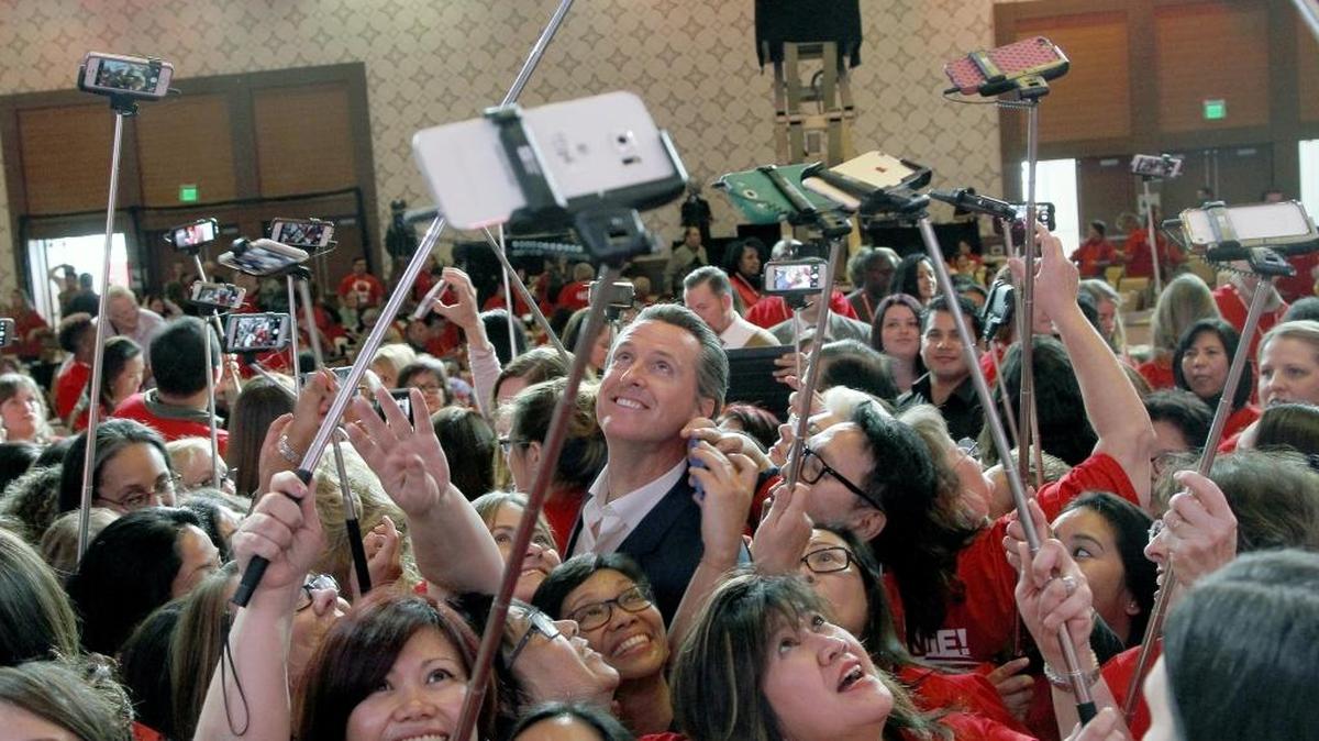 Gavin Newsom, California’s lieutenant governor, has his photo taken with registered nurses from California and across the nation in Los Angeles, Wednesday, Dec. 2, 2015. The politically powerful California Nurses Association endorsed Newsom last year, and on Tuesday endorsed the Proposition 64 marijuana legalization measure.