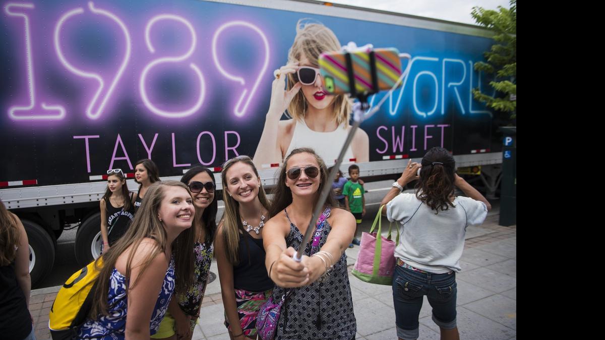 
A group of fans takes a selfie in front of one of Taylor Swift’s 1989 World Tour trailers at Nationals Park in Washington this week.
