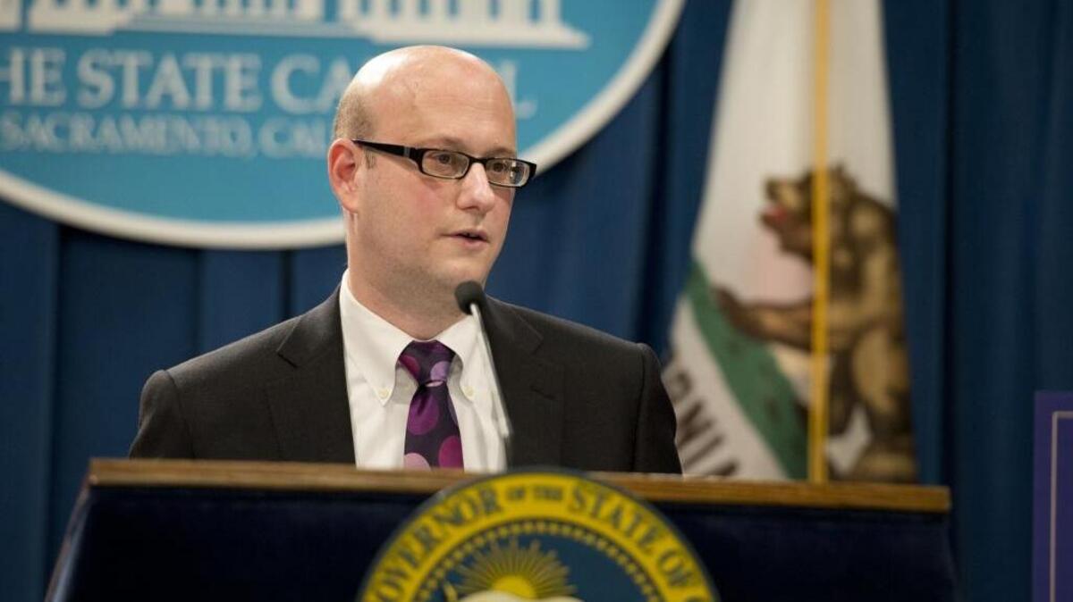 Michael Cohen, then Chief Deputy Director of the Department of Finance, talks to members of the press after Gov. Jerry Brown unveiled his state budget at the Capitol on Jan. 9, 2015.