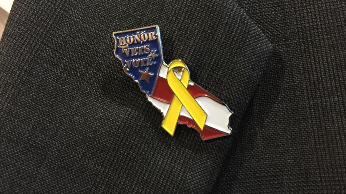 Secretary of State Alex Padilla shows off the “Honor Veterans. Vote.” lapel pin on Nov. 9, 2015.
