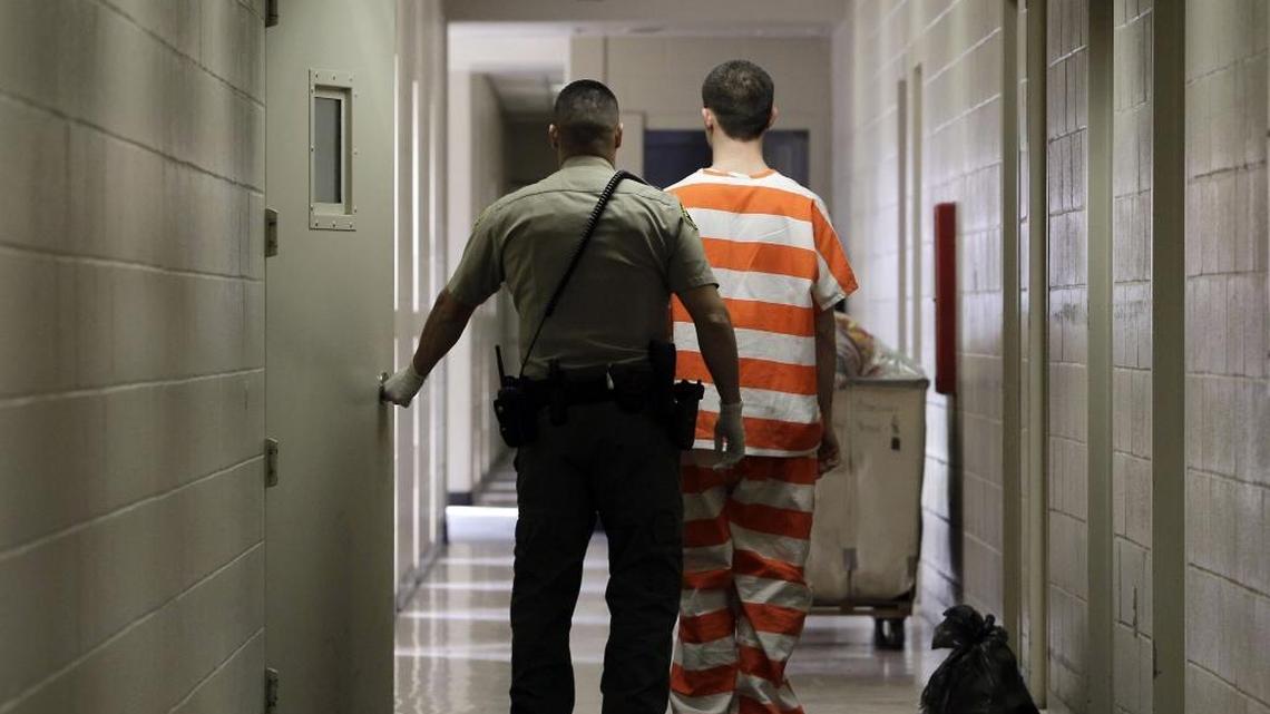 An inmate at the Madera County Jail is taken to a housing unit at the facility in Madera, Calif. The California State Senate sent Gov. Jerry Brown a bill Tuesday that would restore voting rights for thousands of low-level felons in jail.