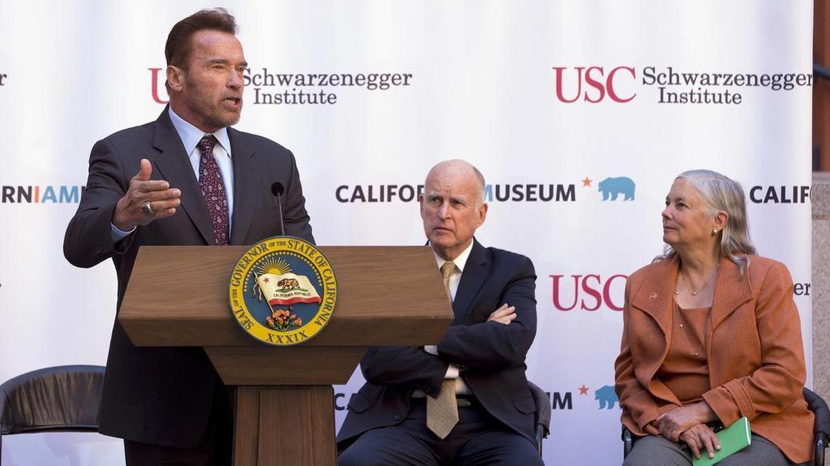 Former Gov. Arnold Schwarzenegger, left, discusses AB32 at the 10th anniversary celebration Wednesday, Oct. 5, 2016, in Sacramento of his signing of California’s landmark global warming bill.