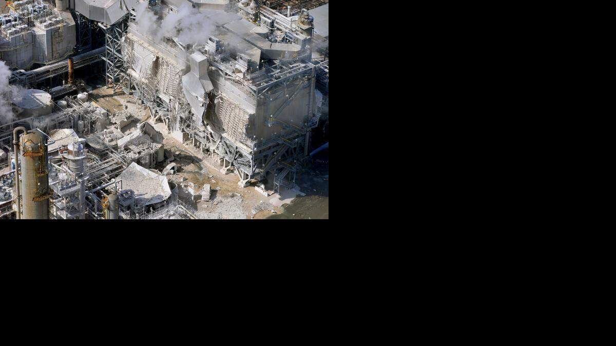
A structure is damaged after an explosion in a processing facility at the ExxonMobil refinery in Torrance on Feb. 18, 2015.
