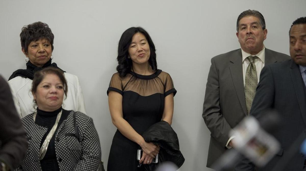 Michelle Rhee listens as her husband, Sacramento Mayor Kevin Johnson, holds a press conference before a discussion on civil rights with basketball legend Kareem Abdul-Jabbar; former San Francisco Mayor and Assembly speaker Willie Brown; sociologist Dr. Harry Edwards; and former major league baseball managers Dusty Baker and Jerry Manuel, in the Setzer Auditorium at the Crocker Art Museum in Sacramento on Monday, February 2, 2015