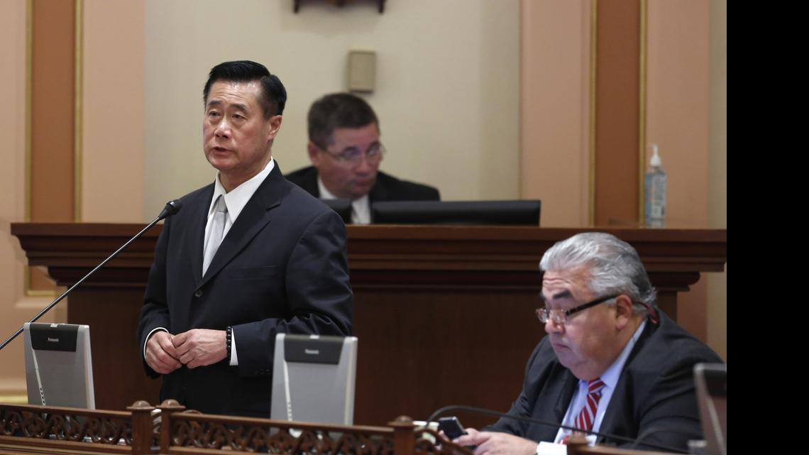 
Former Democratic Sen. Leland Yee, D-San Francisco, left, speaks on a bill, while his seatmate Sen. Ron Calderon, D-Montebello, works at his desk.
