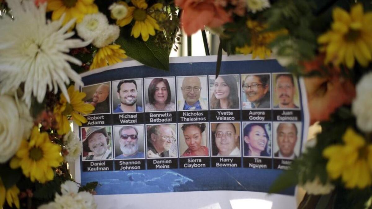Pictures of the shooting victims are displayed at a makeshift memorial site on Dec. 7, 2015 in San Bernardino.