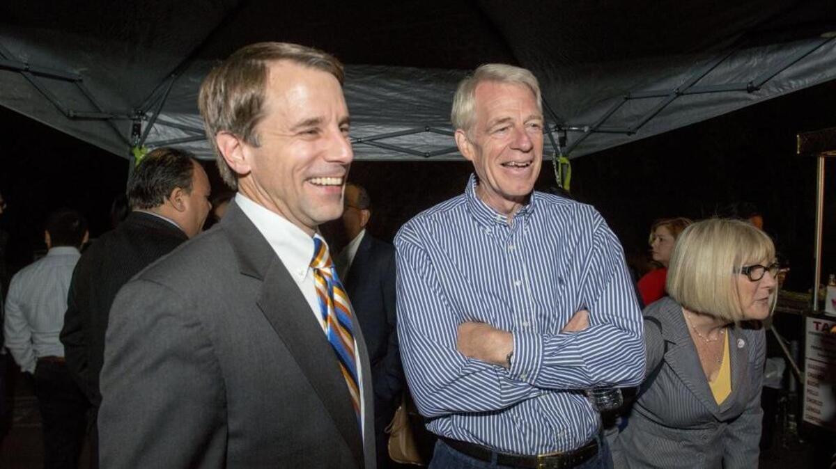 In November 2014, Assemblyman Roger Dickinson laughs with Insurance Commissioner Dave Jones at Dickinson’s campaign headquarters. Jones is a 2018 candidate for attorney general.