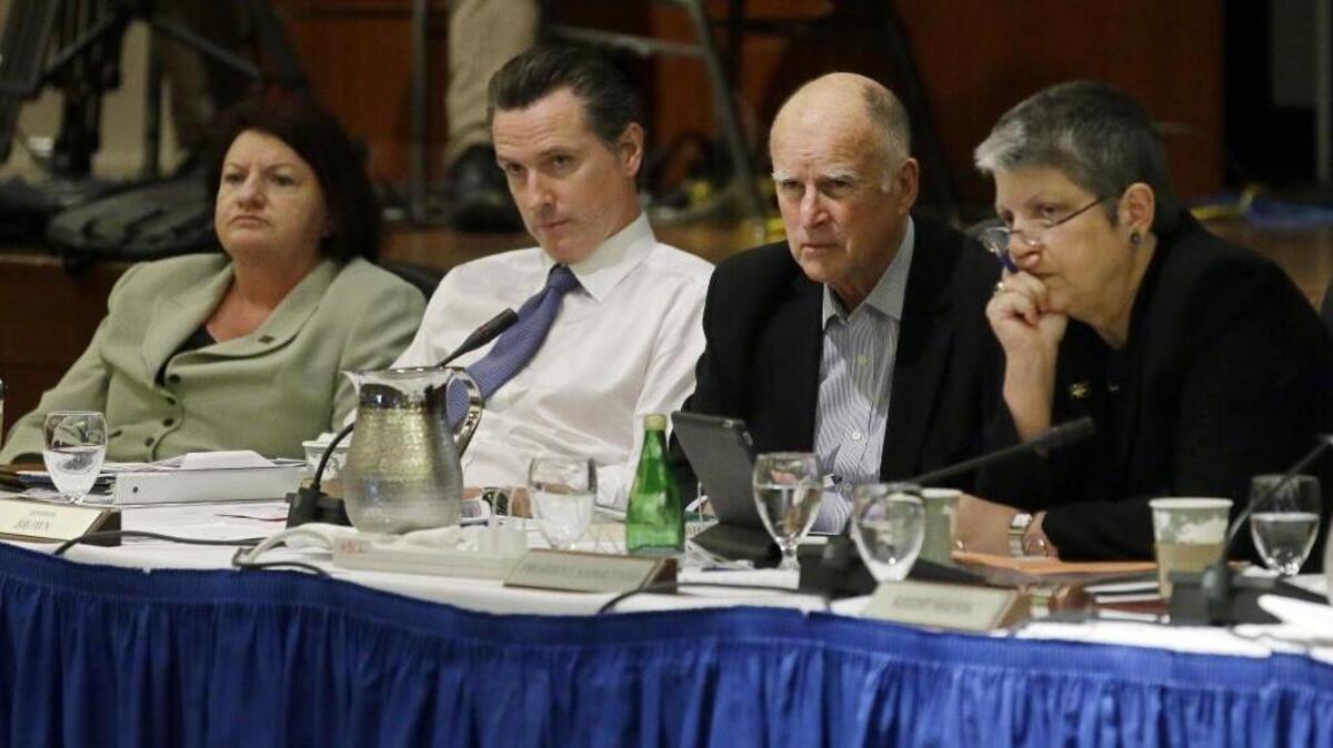 
From left to right, Assembly Speaker Toni Atkins, Lt. Gov. Gavin Newsom, Gov. Jerry Brown, and University of California President Janet Napolitano listen to students speak during the public comments portion of the UC Regents meeting in San Francisco, Thursday, Nov. 20, 2014. 
