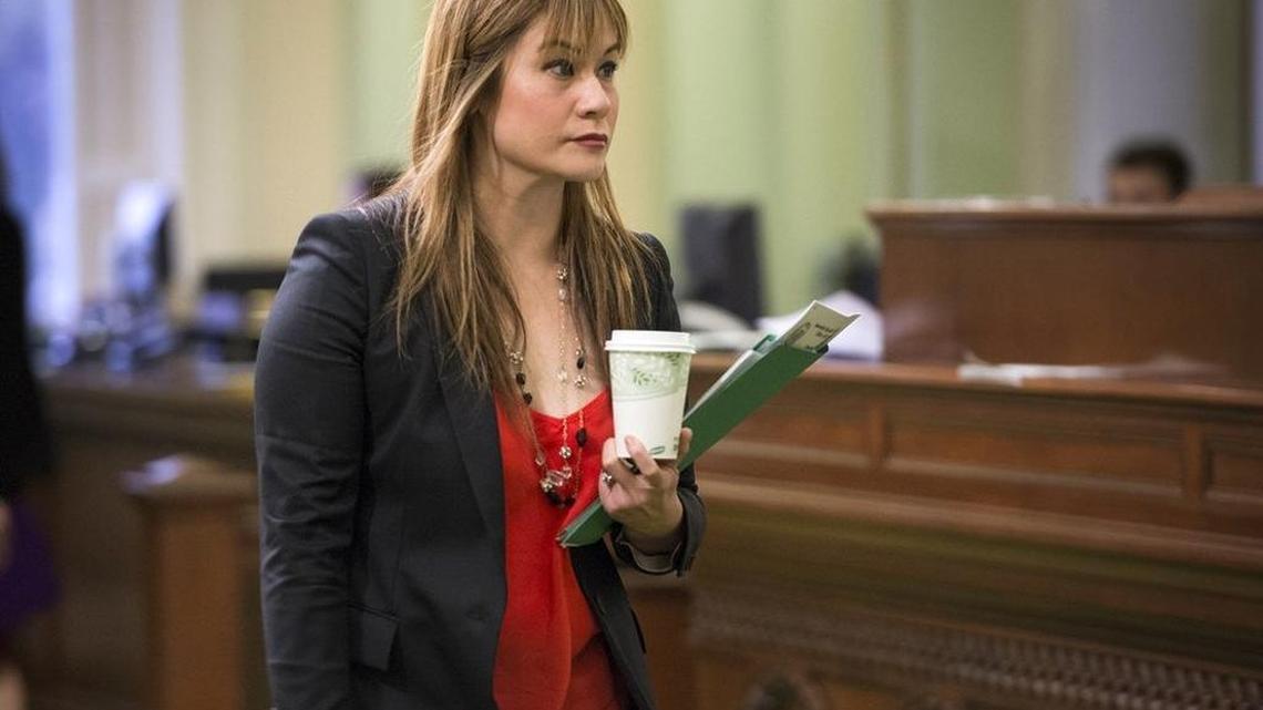 Assemblywoman Ling Ling Chang leaves the chambers at the end of session on Thursday, Feb. 19, 2015.