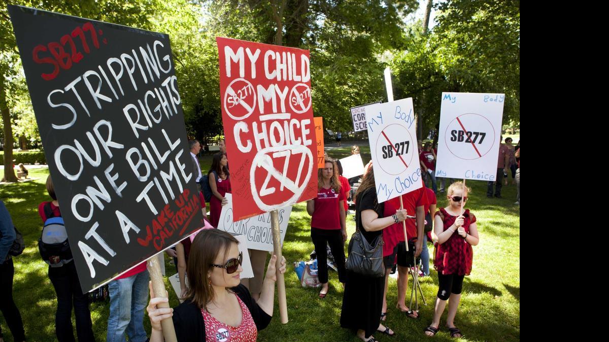
Protestors opposed to the mandatory vaccination bill SB277 rally outside of the Capitol before a Senate hearing on the bill on Tuesday, April 28, 2015 in Sacramento, Calif. 
