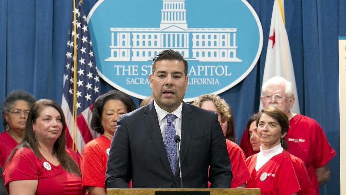 State Sen. Ricardo Lara, D-Bell Gardens, accompanied by members of the California Nurses Association, discusses his single-payer health care bill at a Capitol news conference, Wednesday, May 31, 2017, in Sacramento.