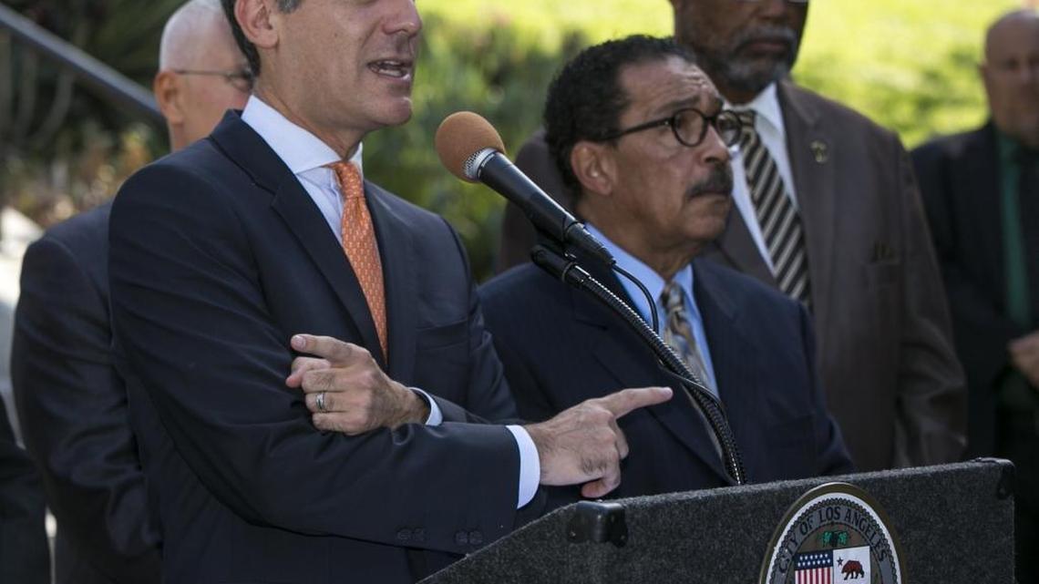 Los Angeles Mayor Eric Garcetti, left, City Council President Herb Wesson, center, and Councilman Curren Price Jr., right, speak outside City Hall in 2015.