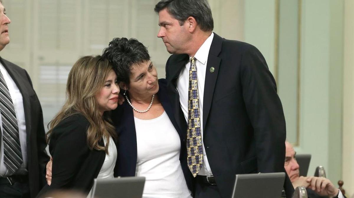 
Assemblywoman Susan Talamantes Eggman, D-Stockton, center, is congratulated by Assembly members Nora Campos, D-San Jose, and Jim Wood, D-Healdsburg, after her right-to die measure was approved by the state Assembly on Wednesday. 
