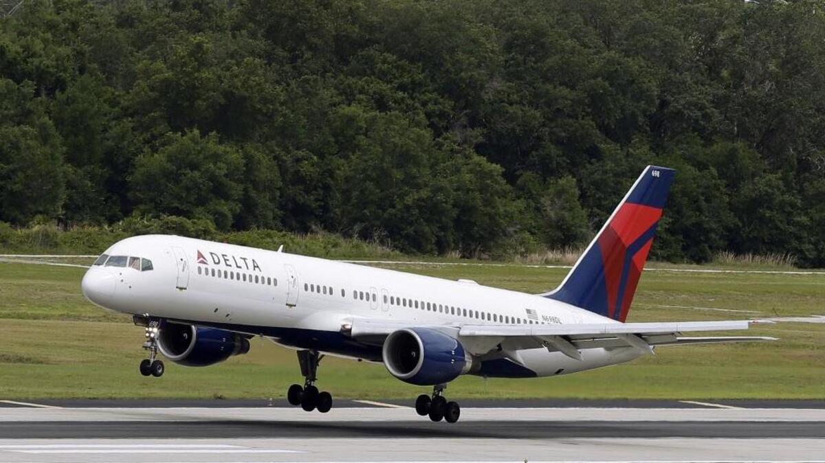 In this 2014 file photo, a Delta Air Lines Boeing 757-232 lands at the Tampa International Airport in Tampa, Fla.