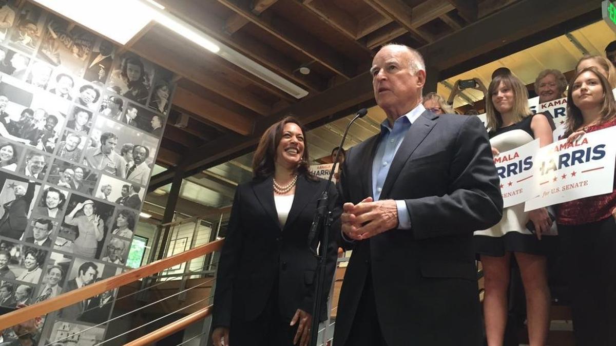 California Attorney General Kamala Harris watches as Gov. Jerry Brown endorses her bid for U.S. Senate in Sacramento. A deal reached between Brown and the union representing attorneys in Harris’ office is nearing legislative approval.