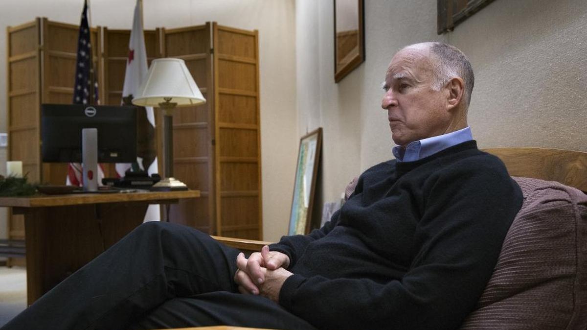Gov. Jerry Brown, shown in his Capitol office in December, says a strong economy helps his approval rating stay high, despite the fact that he sometimes disappoints his own party’s activists.