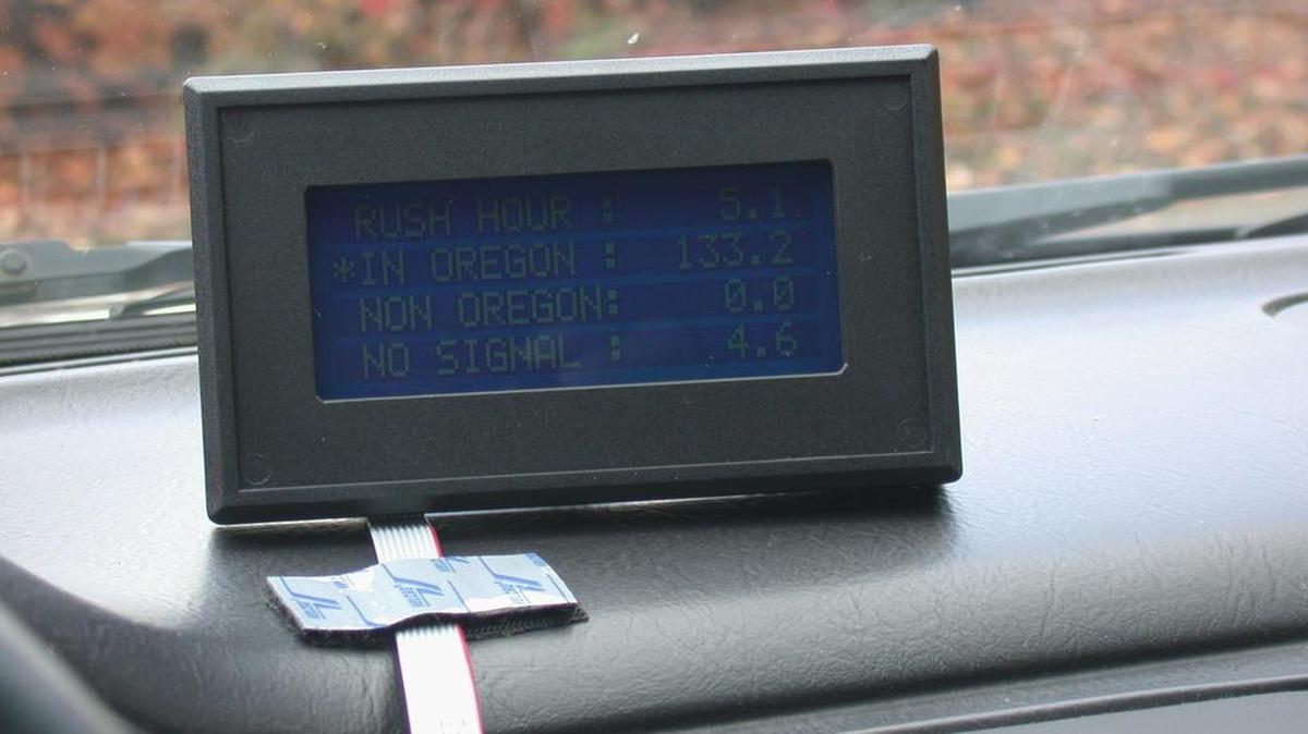 
This undated photo released by the Oregon Department of Transportation shows a display device on the dashboard that indicates how many and what kind of miles a driver has driven. Proponents of a California transportation funding approach excluded mileage-tracking systems from its suggested revenue sources.
