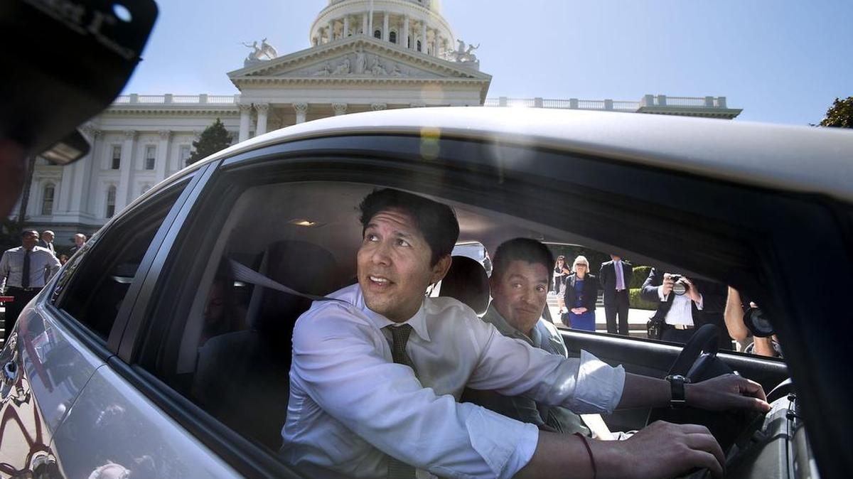 
Senate President Pro Tem Kevin de León, left, drives off in a Toyota Prius at the Capitol launch of a clean car trade-in program on May 27, 2015.
