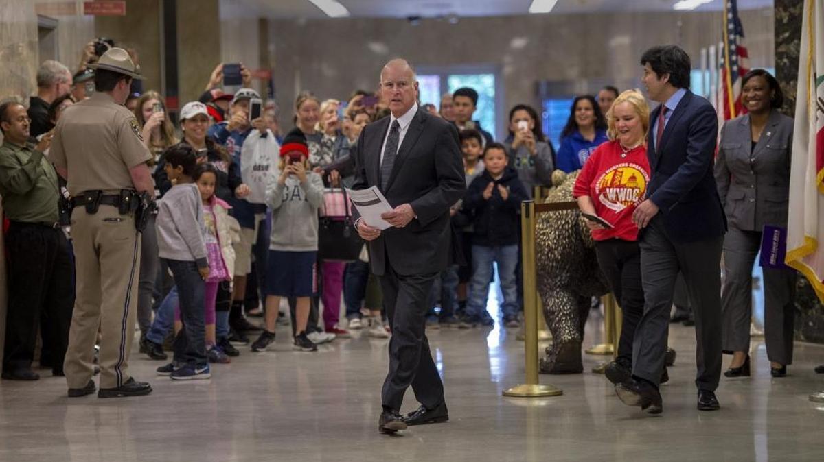 Gov. Jerry Brown joined legislators and labor leaders to announce a landmark agreement that makes California the first state in the nation to commit to raising the minimum wage to $15 per hour statewide on Mon., Mar. 28, 2016 in Sacramento, Calif.