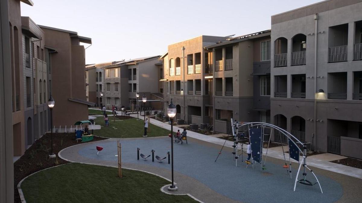 Children play in the play area at the New Harmony Mutual Housing Community on February 13, 2013 in Davis, Calif. The affordable apartment complex, which slipped in before the state folded its redevelopment agencies, has nearly 70 apartments for individuals and families who earn 30- to 60-percent of the area's median income.