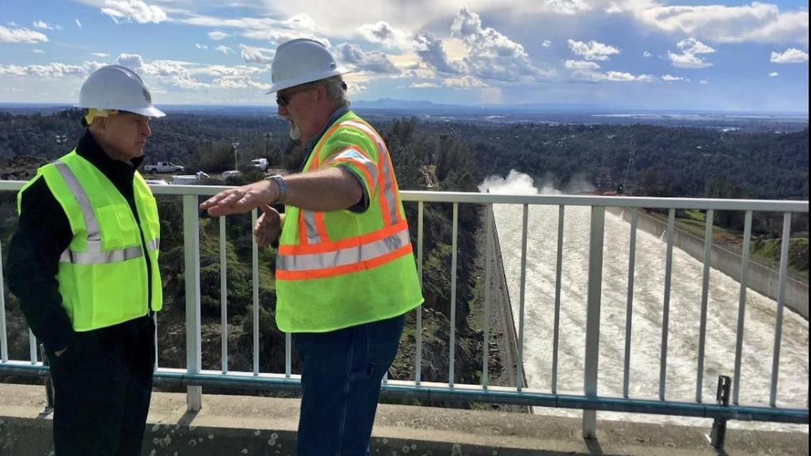 Gov. Jerry Brown, left, gets a briefing from William A. Croyle, acting director of the Department of Water Resources, at the Oroville Dam on Wednesday February 22, 2017.