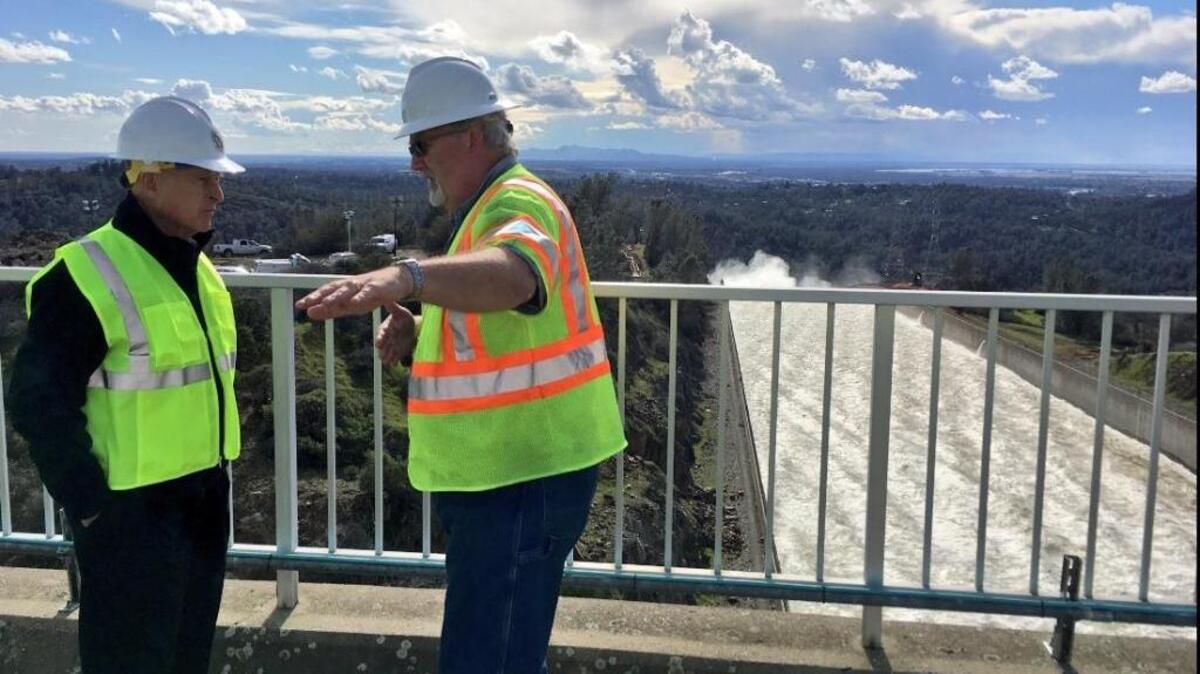 Gov. Jerry Brown, left, gets a briefing from William A. Croyle, acting director of the Department of Water Resources, at the Oroville Dam on Wednesday February 22, 2017.