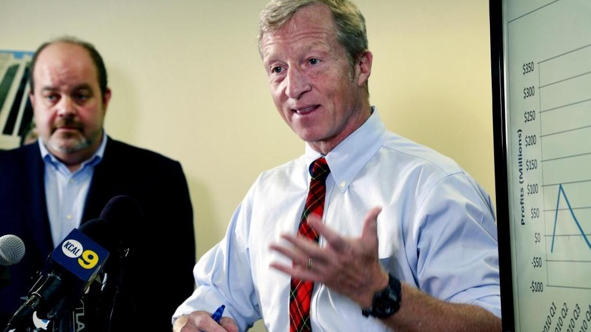 Billionaire climate activist Tom Steyer, right, speaks during a news conference with consumer advocate Jamie Court, left, president of Consumer Watchdog in Santa Monica, Calif. on Wednesday, Aug. 5.