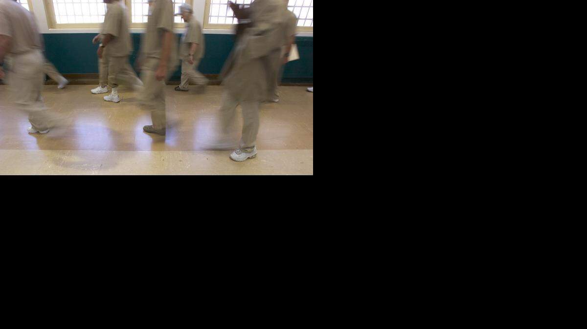 
Patients at Atascadero State Hospital walk to lunch together in line from their section on Thursday July 7, 2005.
