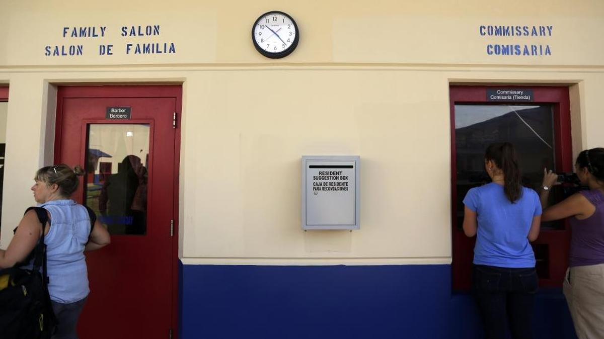 In this July 31, 2014 file photo, a suggestion box hangs on the wall outside of the hair salon and commissary at the Karnes County Residential Center, in Karnes City, Texas.