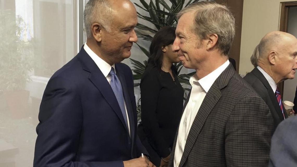 Tom Steyer, right, shakes hands with state Sen. Ed Hernandez, following a bill signing at the Capitol in Sacramento Oct. 9, 2017.