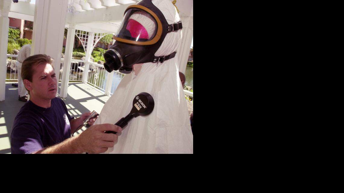 
A firefighter uses a Geiger counter to find radioactive particles on the test dummy during an exercise at a conference on hazardous materials on Thursday Sept. 5, 2002. Sacramento Bee/ Brian Baer
