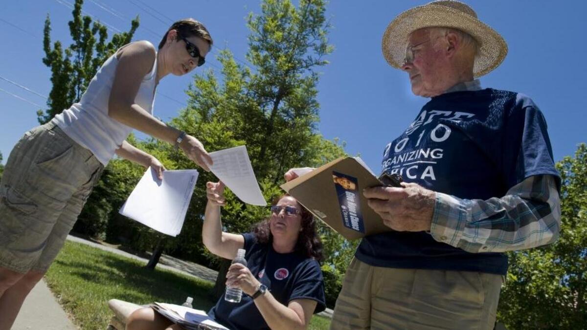Jennifer Charron, 37, left, of Carmichael, Noralee Bauthues Stewart, 54, center, of Fair Oaks and Bob Fossgreen, 81, right, of Elk Grove get ready to precinct walk in Elk Grove to get out the word to vote on June 5, 2010.
