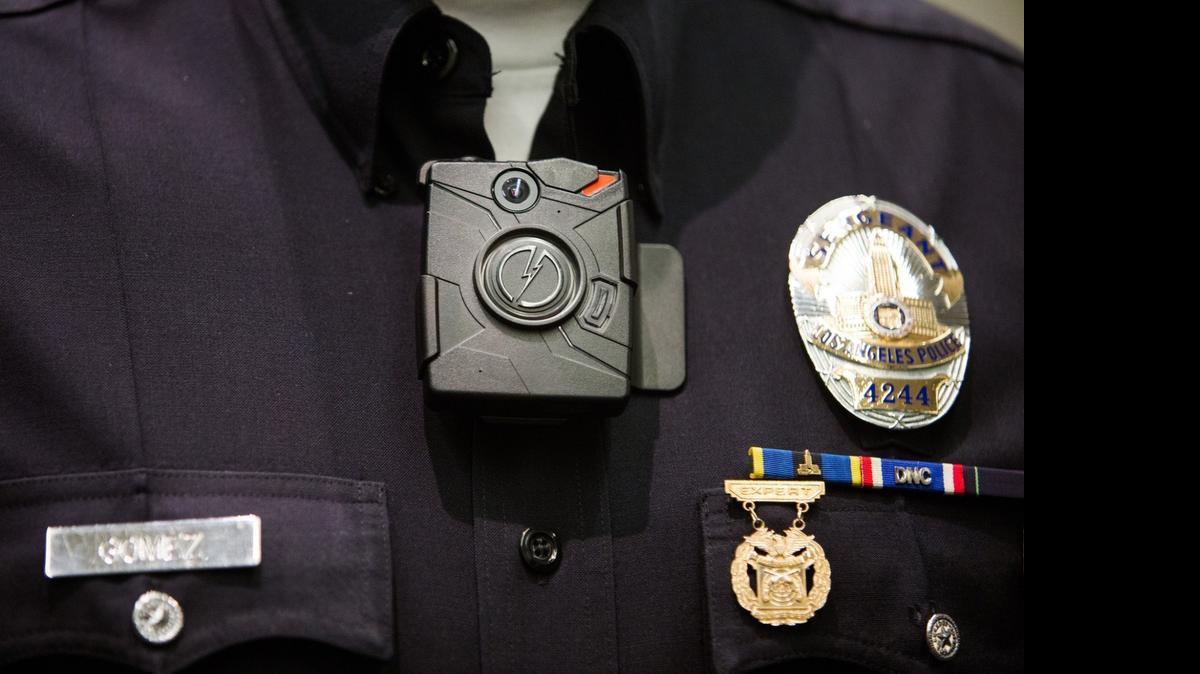 
A body camera is shown on a police officer.
