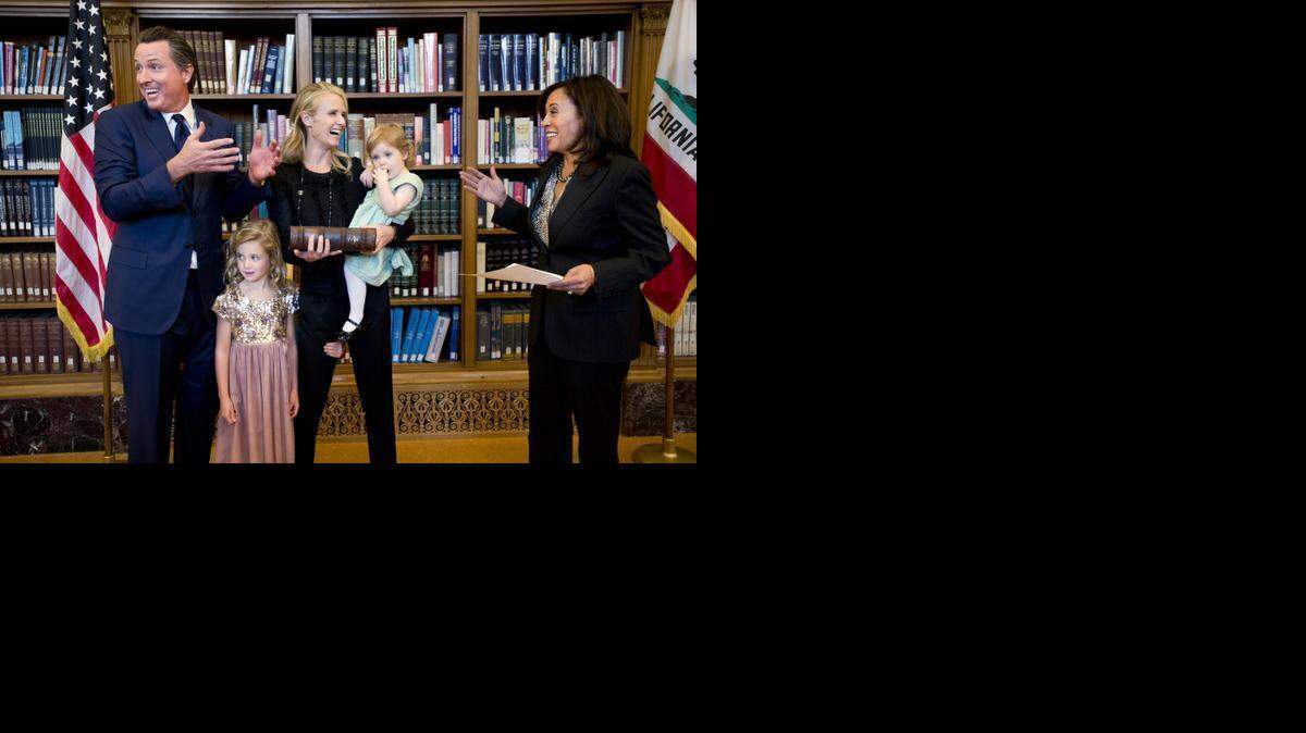 
Lt. Gov. Gavin Newsom laughs before he is sworn into office by Attorney General Kamala Harris at the Stanley Mosk Library and Courts Building Monday January 5, 2015 in Sacramento, Calif.
