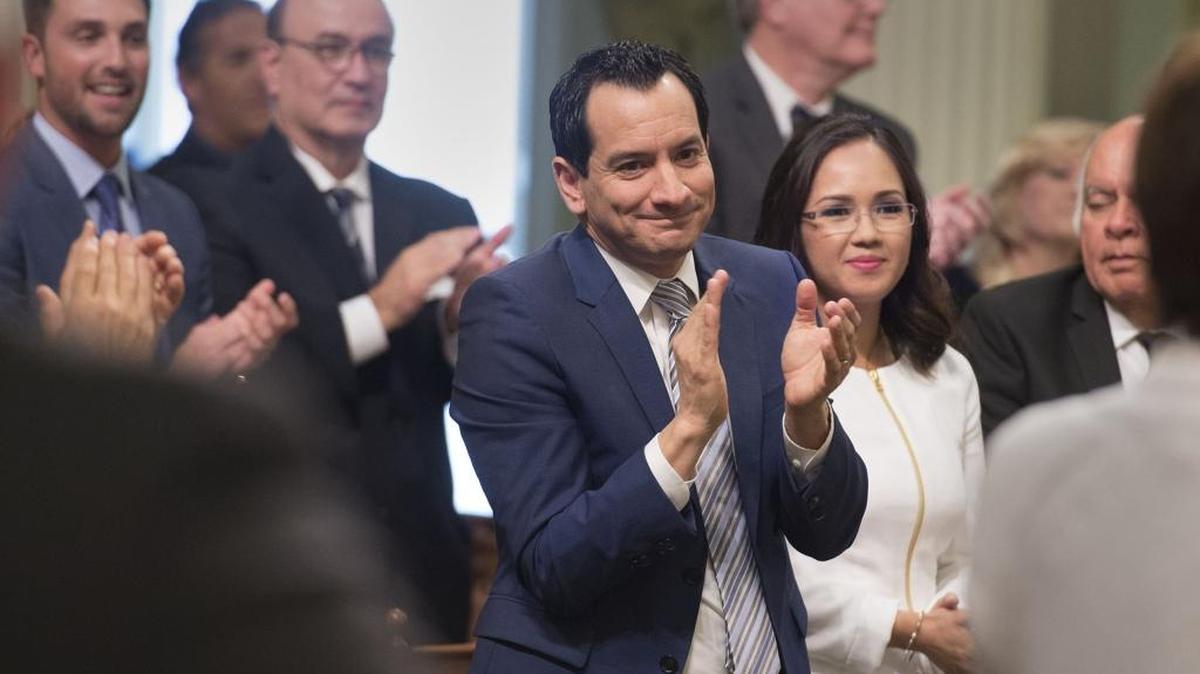 Anthony Rendon, D-Lakewood, stands with his wife, Annie Lam, while he is acknowledged by fellow members of the Assembly before sworn in as the new Assembly speaker on Monday, March 7, 2016 in Sacramento.