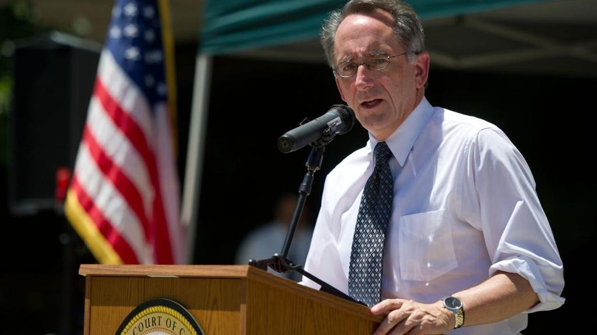 Joe Dunn, former executive director of the State Bar of California, speaks at a protest outside the Sacramento County Courthouse on Tuesday, June 13, 2012.